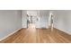 Open living area with hardwood flooring connecting to the modern kitchen at 12893 W Alameda Dr, Lakewood, CO 80228