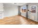 Bright and open living space featuring hardwood floors, a backdoor, and a view to the outside at 12893 W Alameda Dr, Lakewood, CO 80228