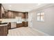 Modern kitchen featuring wooden cabinets, stainless steel appliances, and white subway tile backsplash at 1330 E 90Th Ave, Thornton, CO 80229