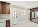 Stylish kitchen with wooden cabinets, stainless steel appliances, and white subway tile backsplash at 1330 E 90Th Ave, Thornton, CO 80229