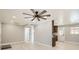 Spacious living room with modern ceiling fan and light wood floors at 1330 E 90Th Ave, Thornton, CO 80229