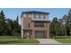 Beautiful, modern two-story home featuring a brick facade and attached two-car garage at 7736 S Cherokee Trl, Centennial, CO 80016