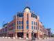 Exterior shot of Coors Field, with its brick facade, clock tower, and the American flag waving above at 2960 Inca St # 116, Denver, CO 80202