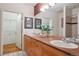 Bright bathroom with double sinks, spacious countertop, and framed art at 2960 Inca St # 116, Denver, CO 80202
