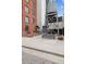 An urban space featuring industrial-style buildings and a vintage watertower, with an inviting bench at 2960 Inca St # 116, Denver, CO 80202