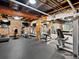 Community gym with modern equipment and brick accent walls for a stylish workout space at 2960 Inca St # 116, Denver, CO 80202