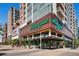 Exterior of Whole Foods Market in a mixed-use building, with its green signage and outdoor seating area at 2960 Inca St # 116, Denver, CO 80202
