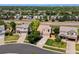 Aerial view of a suburban home with mature trees, well-manicured lawns, and a cul-de-sac at 18554 E Vassar Dr, Aurora, CO 80013