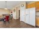 View of the kitchen and dining room from the living room in an open-concept house at 18554 E Vassar Dr, Aurora, CO 80013