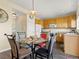 Charming eat-in kitchen featuring classic cabinetry, modern appliances, and ample natural light at 18554 E Vassar Dr, Aurora, CO 80013