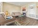 Inviting living room featuring a modern fireplace, hardwood floors, and ample natural light at 18554 E Vassar Dr, Aurora, CO 80013