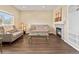 Inviting living room featuring a modern fireplace, hardwood floors, and ample natural light at 18554 E Vassar Dr, Aurora, CO 80013