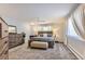 Bright bedroom featuring a comfortable king-size bed and plush carpet at 5760 S Geneva St, Greenwood Village, CO 80111