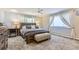 King-size bed in a well-lit bedroom with lots of closet space at 5760 S Geneva St, Greenwood Village, CO 80111