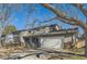 Two-story house with a large tree in front and a swing set at 5760 S Geneva St, Greenwood Village, CO 80111