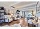 Bright living room with hardwood floors, fireplace, and access to a patio at 5760 S Geneva St, Greenwood Village, CO 80111