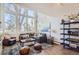 Spacious living room with hardwood floors, large windows, and comfortable seating at 5760 S Geneva St, Greenwood Village, CO 80111