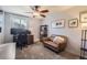 Functional home office with a comfortable couch and work desk at 5760 S Geneva St, Greenwood Village, CO 80111