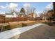 Large backyard with a patio, landscaping, and a wooden fence at 15037 E Carolina Pl, Aurora, CO 80012