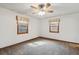 Bright bedroom with ceiling fan and neutral carpeting at 15037 E Carolina Pl, Aurora, CO 80012