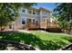 Beautiful backyard featuring a well-maintained lawn and spacious deck, perfect for outdoor enjoyment at 3466 Craftsbury Dr, Highlands Ranch, CO 80126