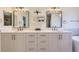 Elegant bathroom with dual sinks, quartz countertop, and decorative lighting offering a modern and stylish space at 3466 Craftsbury Dr, Highlands Ranch, CO 80126