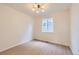 Bright, minimalist bedroom with hardwood floors, neutral walls, modern lighting and a large window at 3466 Craftsbury Dr, Highlands Ranch, CO 80126