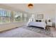 Bright bedroom with large windows, neutral decor, and a cozy rug creating a serene atmosphere at 3466 Craftsbury Dr, Highlands Ranch, CO 80126