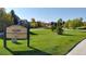 Well-maintained community park with lush green grass, mature trees, and walking paths at 3466 Craftsbury Dr, Highlands Ranch, CO 80126