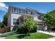 Charming two-story home with lush landscaping, a two-car garage and a well maintained lawn at 3466 Craftsbury Dr, Highlands Ranch, CO 80126