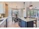 Open kitchen with stainless appliances, a large island, eat-in table, and access to the outdoor deck at 3466 Craftsbury Dr, Highlands Ranch, CO 80126