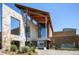 Modern recreation center featuring stone and wood design, with large glass windows and landscaping at 3466 Craftsbury Dr, Highlands Ranch, CO 80126