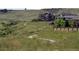 Picturesque walking trail winds through a grassy area, offering a scenic view of nearby homes at 3466 Craftsbury Dr, Highlands Ranch, CO 80126