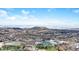 Scenic aerial view overlooking a town with a sports complex, roads, and stunning mountain range backdrop at 1263 S Gilbert St, Castle Rock, CO 80104