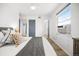 Sunny bedroom features a ceiling fan, hardwood floors, and a comfortable bed at 1263 S Gilbert St, Castle Rock, CO 80104