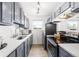 Efficient kitchen with stainless steel appliances, white countertops, and ample cabinet space at 1263 S Gilbert St, Castle Rock, CO 80104