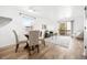 Open-concept living room and dining area with hardwood floors and natural light from the sliding doors at 1263 S Gilbert St, Castle Rock, CO 80104