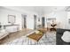 Spacious open concept living and dining area with hardwood floors and stylish furnishings at 1263 S Gilbert St, Castle Rock, CO 80104
