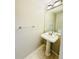 Clean and simple bathroom with a pedestal sink and neutral color scheme at 1120 S Waco St # A, Aurora, CO 80017
