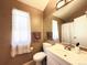 Neutral bathroom features a single sink, updated vanity and a decorative mirror at 1120 S Waco St # A, Aurora, CO 80017