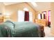 Bright bedroom with vaulted ceiling, skylights, and large windows for natural light at 1120 S Waco St # A, Aurora, CO 80017