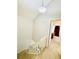 Upper level hallway leading to a bedroom with vaulted ceiling and lots of light at 1120 S Waco St # A, Aurora, CO 80017