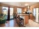 Eat-in kitchen with stainless steel appliances, granite countertops, and access to the outdoor patio at 1120 S Waco St # A, Aurora, CO 80017
