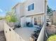 Back patio with white wood fence. Outdoor space great for container gardening at 1120 S Waco St # A, Aurora, CO 80017