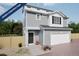 Charming two-story home with gray siding, white trim, and a convenient attached garage at 46517 Sunflower Ln, Bennett, CO 80102