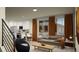 Comfortable living room space with a modern sofa, stylish decor, and bright natural light at 46517 Sunflower Ln, Bennett, CO 80102