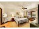 Inviting bedroom features hardwood floors, stylish furnishings, and a full-length mirror at 963 N Logan St # 2, Denver, CO 80203