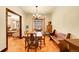 Charming dining room featuring parquet floors, bench seating, and an adjacent living area with lots of natural light at 963 N Logan St # 2, Denver, CO 80203