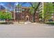 Brick apartment building with mature trees and landscaping is located in the city at 963 N Logan St # 2, Denver, CO 80203