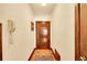 Hallway featuring parquet wood flooring and textured walls with a classic aesthetic at 963 N Logan St # 2, Denver, CO 80203